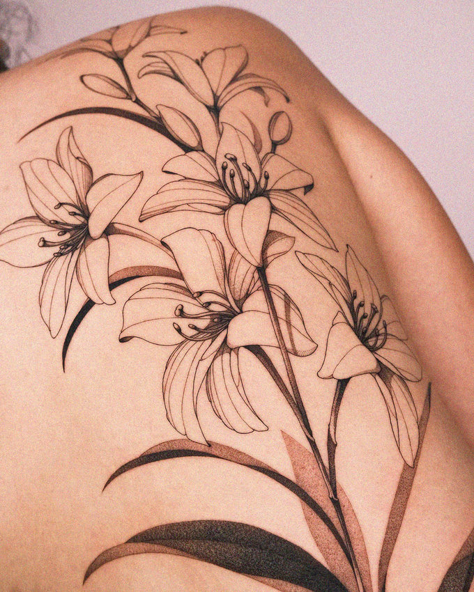 Intricate Lily Tattoo Adorns Human Canvas