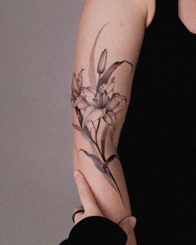 Etched Elegance of a Lily Tattoo
