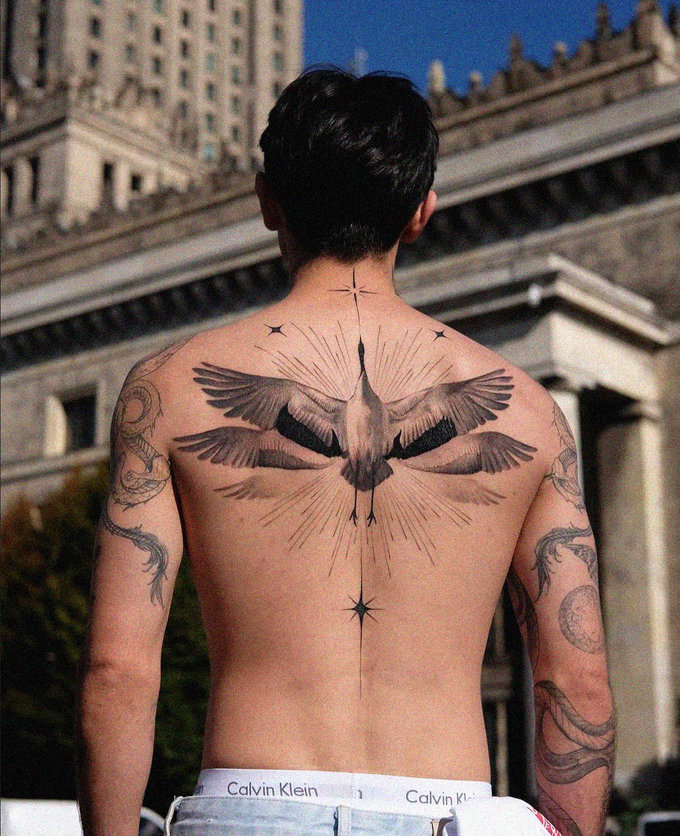 Bird Ink Beneath an Urban Canvas