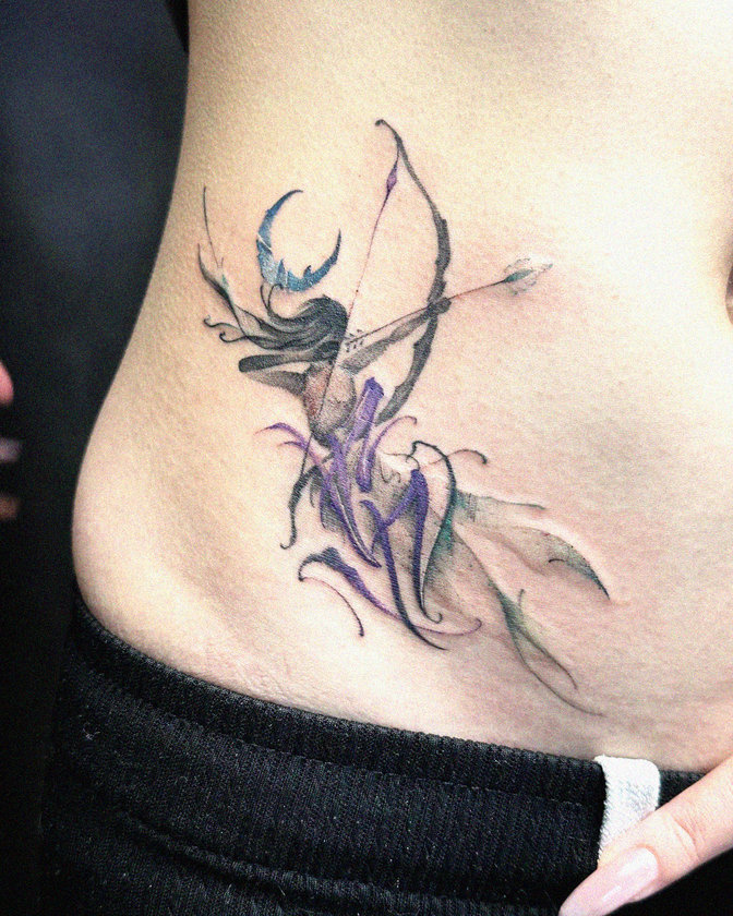 Fantasy Archer Tattoo Adorns the Waistline