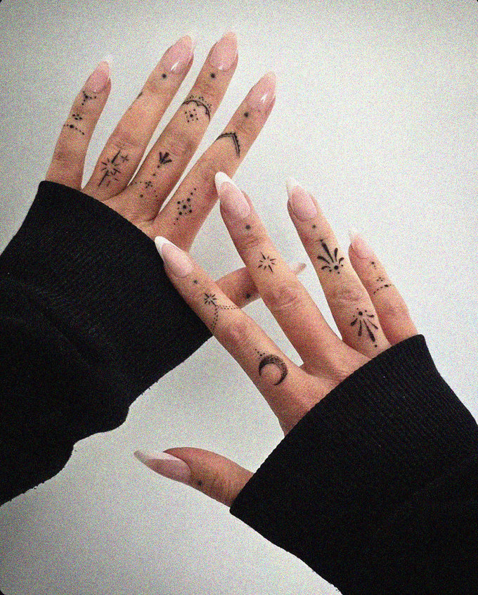 Tattooed Hands in Overlapping Embrace