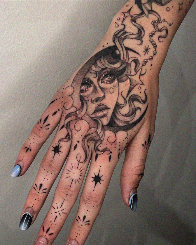 Celestial Woman: Tattooed Beauty in Metallic Tones