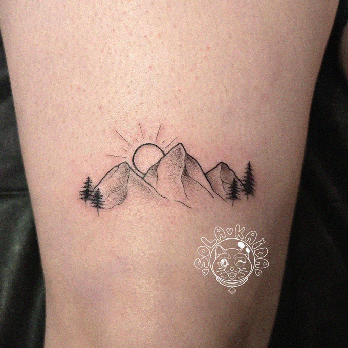 Mountain Range Tattoo Bathed in Sunlight