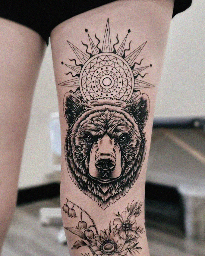 Wild Intricacy: Bear and Floral Tattoo