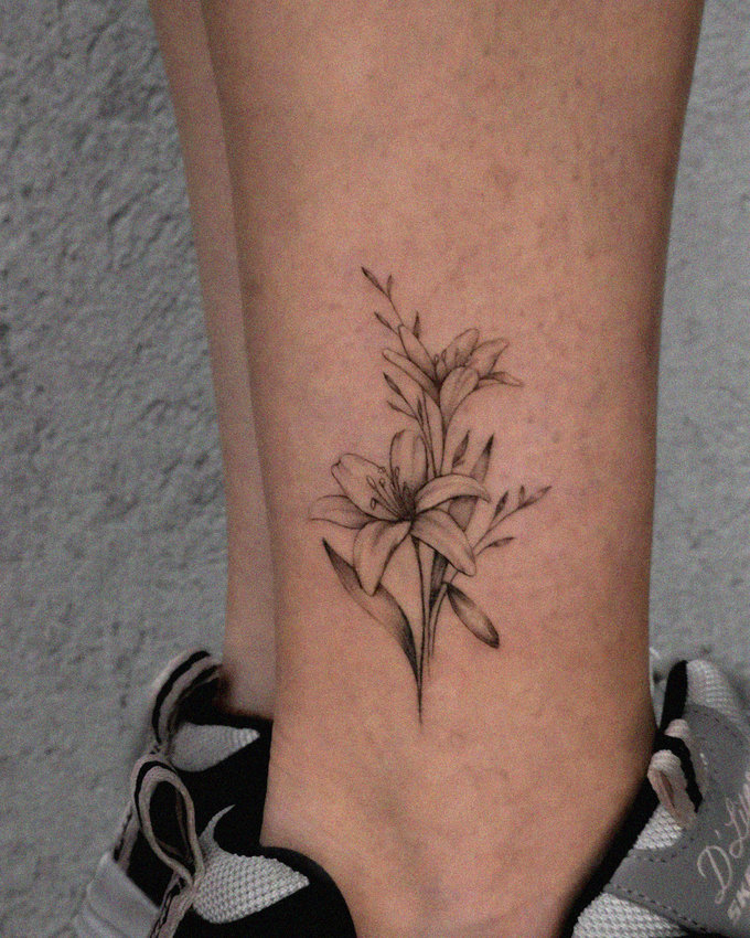 Inked Blossoms on a Delicate Ankle
