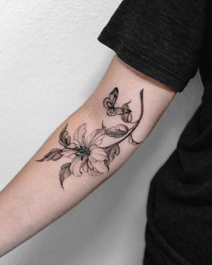 Inked Blossoms and Butterflies on Forearm