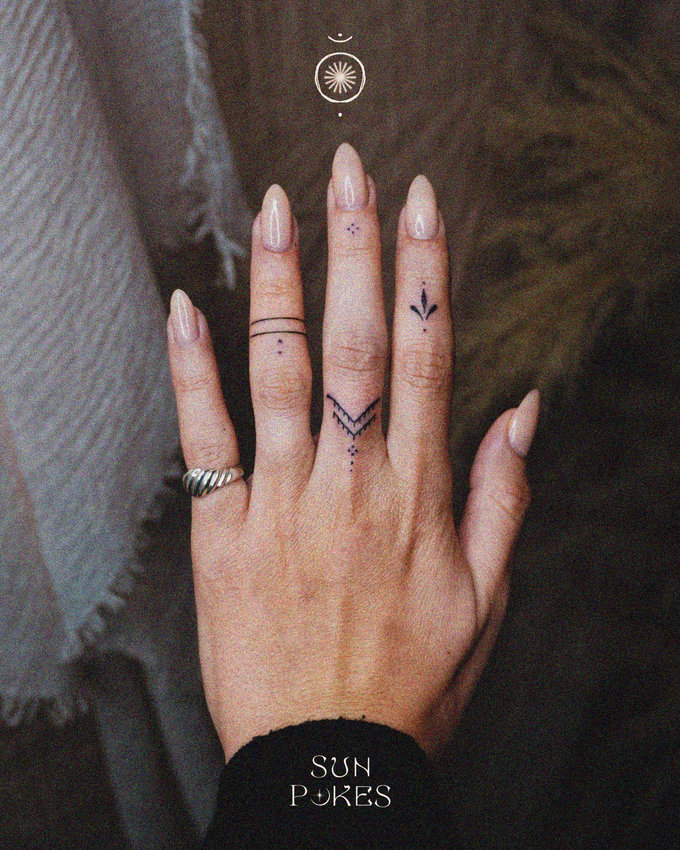 Inked Hand with Silver Ring Contrast