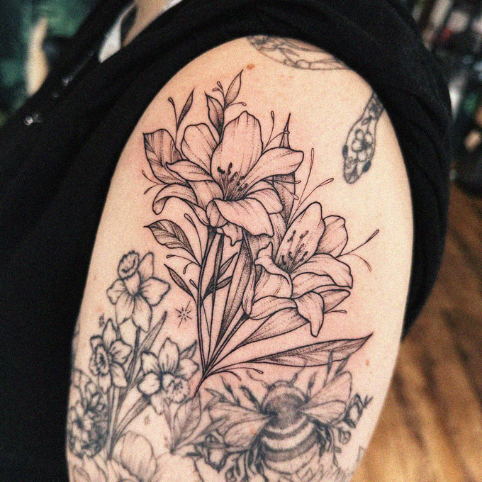Inked Elegance: Blooming Lilies on Skin