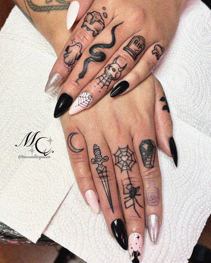 Intricate Tattoos Adorn Stylized Nail Art