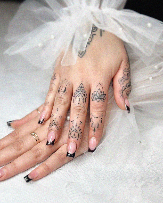 Hands Adorned with Ink and Pearls