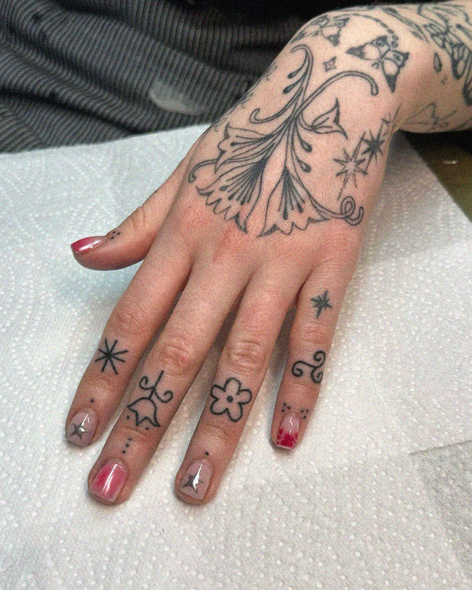 Intricate Tattoo and Artistic Nail Design