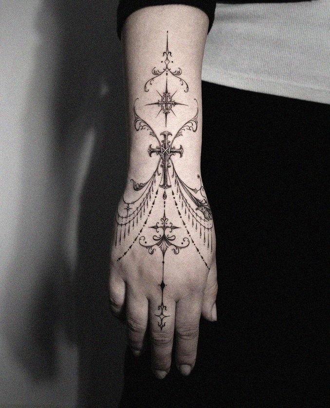 Hand Tattoo with Embellished Cross Design