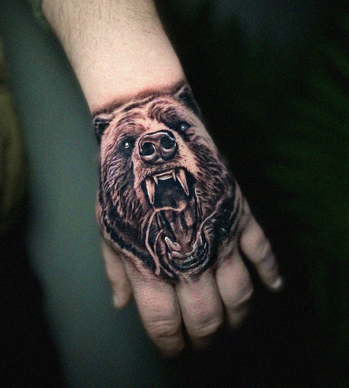 Roaring Bear Tattoo Graces Hand Canvas