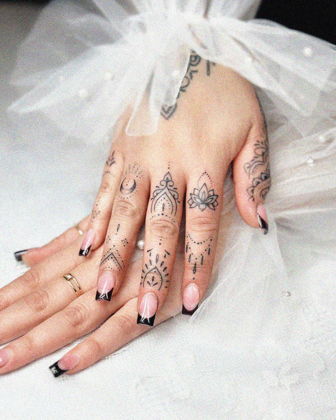 Adorned Fingers: Tattoos, Nail Art, and Jewelry